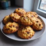 A plate of freshly baked banana bread cookies with chocolate chips, ready to be enjoyed.