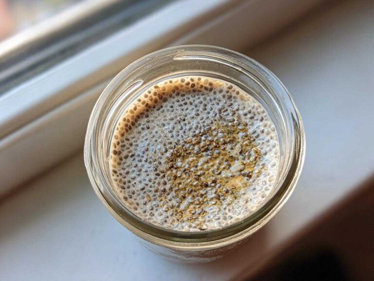 Overhead shot of 3-ingredient chia pudding in a glass jar, showing the texture and simple ingredients.